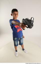 TIMBO STANDING POSE WITH GUN